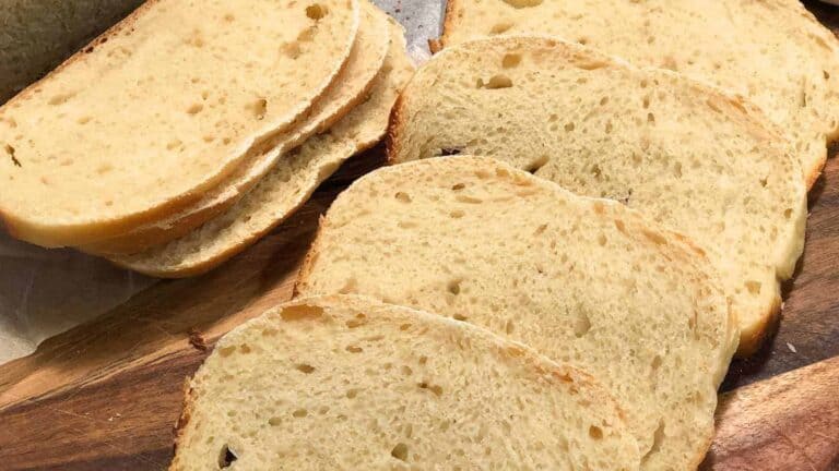 Slices of bread arranged on a wooden board.
