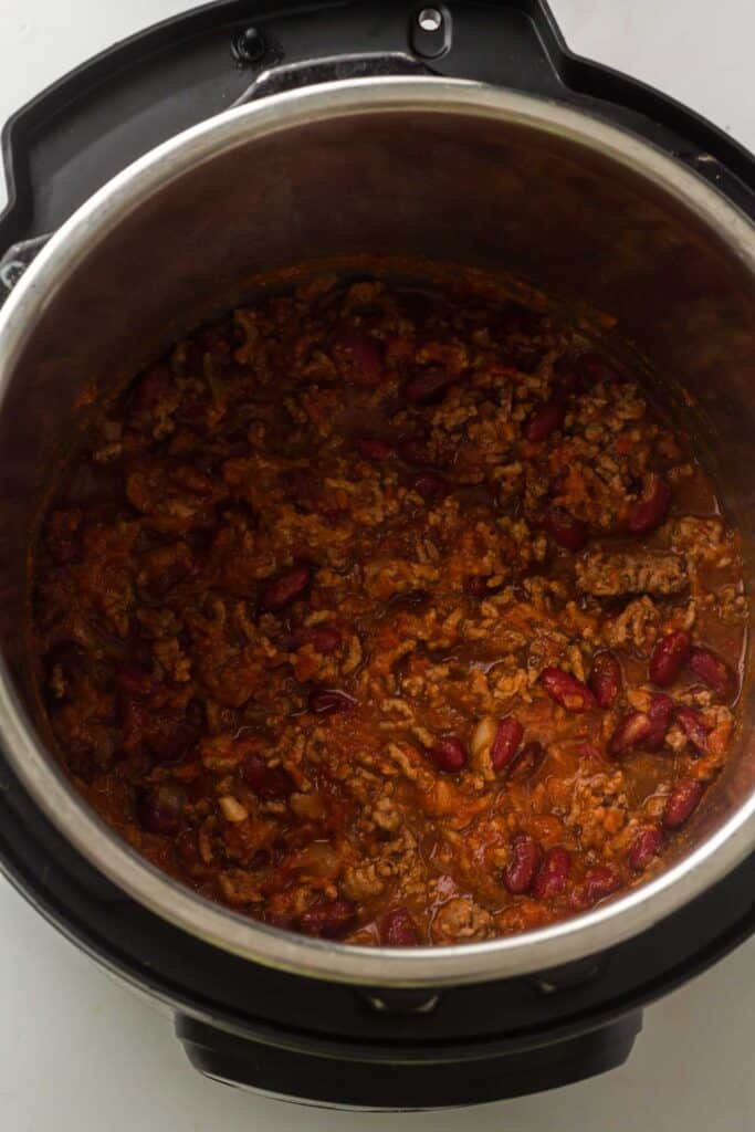 Instant Pot Chili with ground beef and kidney beans, viewed from above. The thick, tomato-based sauce makes this hearty Instant Pot favorite perfect for cozy dinners.