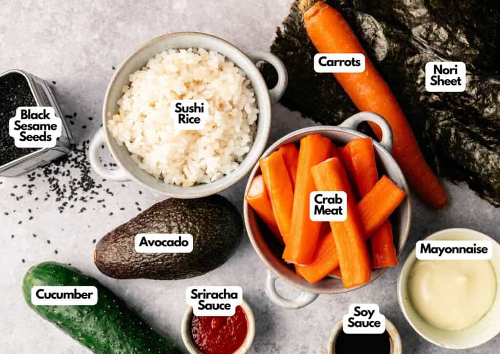 Top-down view of California Roll Sushi Bowl ingredients&mdash;sushi rice, carrots, crab meat, nori sheet, mayonnaise, soy sauce, sriracha, avocado, cucumber, and black sesame seeds&mdash;all neatly labeled.