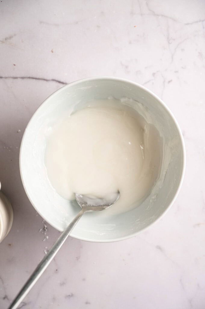 Overhead view of powdered sugar icing mixed to a pipeable consistency