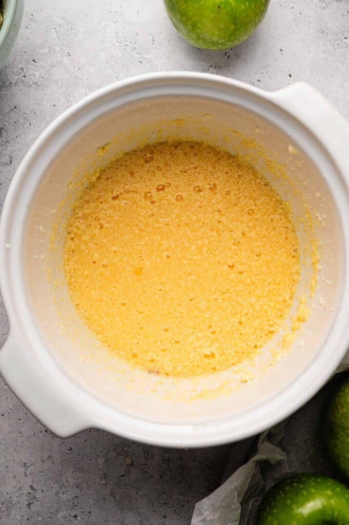 Smooth yellow cake batter in a white mixing bowl