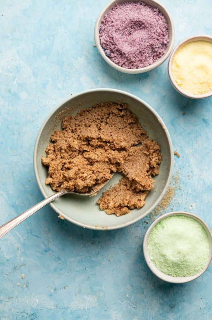 Overhead view of spreadable cinnamon butter filling next to colored sanding sugars