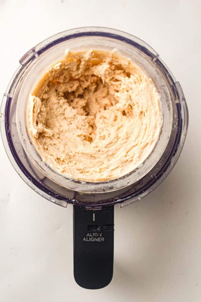 Creamy churned chocolate ice cream inside a Ninja Creami container after spinning