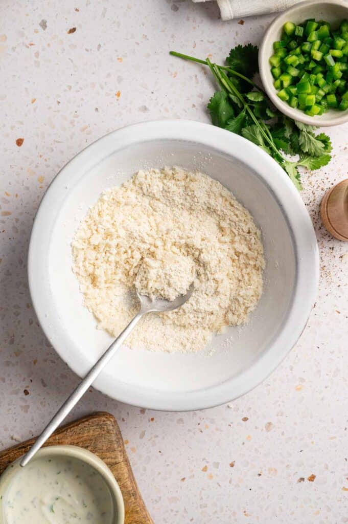 Panko breadcrumbs mixed with flour and seasonings in a bowl