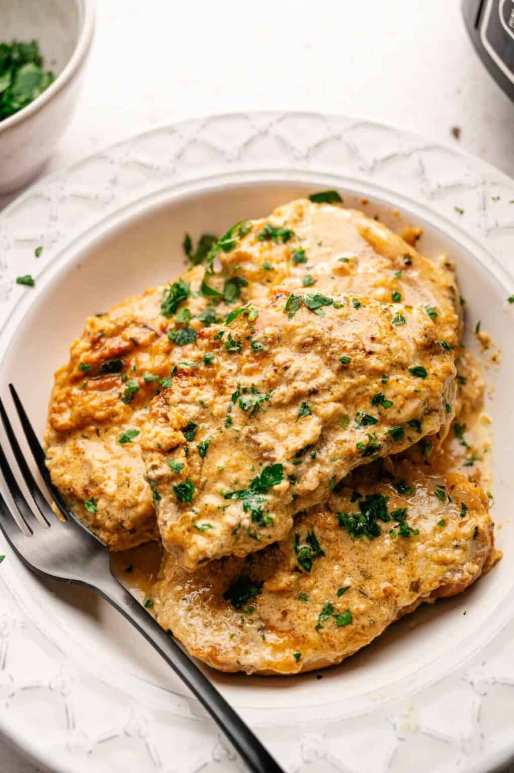 Creamy Slow Cooker Pork Chops Recipe - Hungry Cooks Kitchen