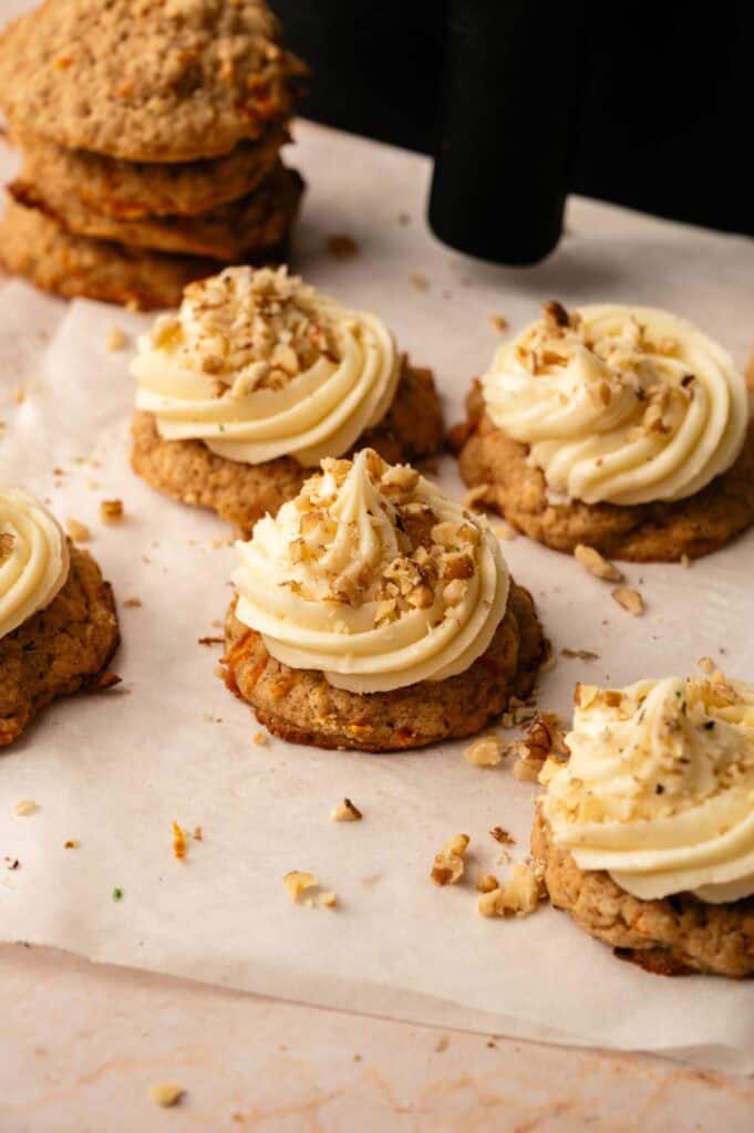Air Fryer Carrot Cake Cookies with cream cheese frosting; spiced carrot and walnut cookie sandwiches or individual frosted cakes.
