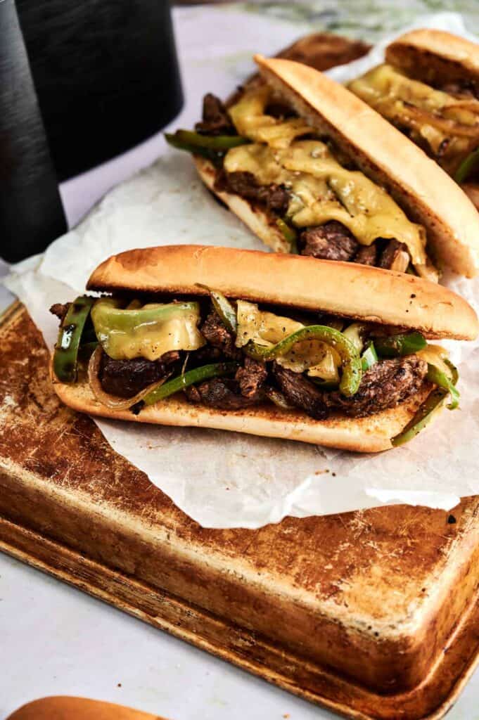 Toasted hoagie roll filled with steak, peppers, onions, and melted provolone cheese