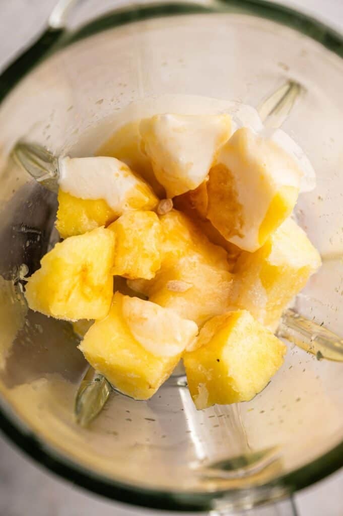 Frozen fruits in a blender.